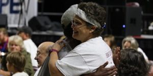 two members hugging